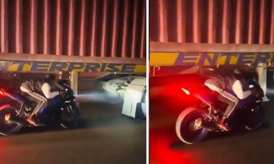 ಚಲಿಸುವ ಟ್ರಕ್‌ ಕೆಳಗೆ ಬೈಕ್‌ ಓಡಿಸಿ ಯುವಕನಿಂದ ಹುಚ್ಚಾಟ