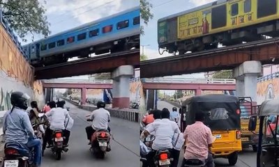 ರೈಲು ಹಾದು ಹೋಗುತ್ತಿದ್ದರೆ ಸೇತುವೆಯ ಕೆಳಗೆ ಕಾದುನಿಂತ ಜನ