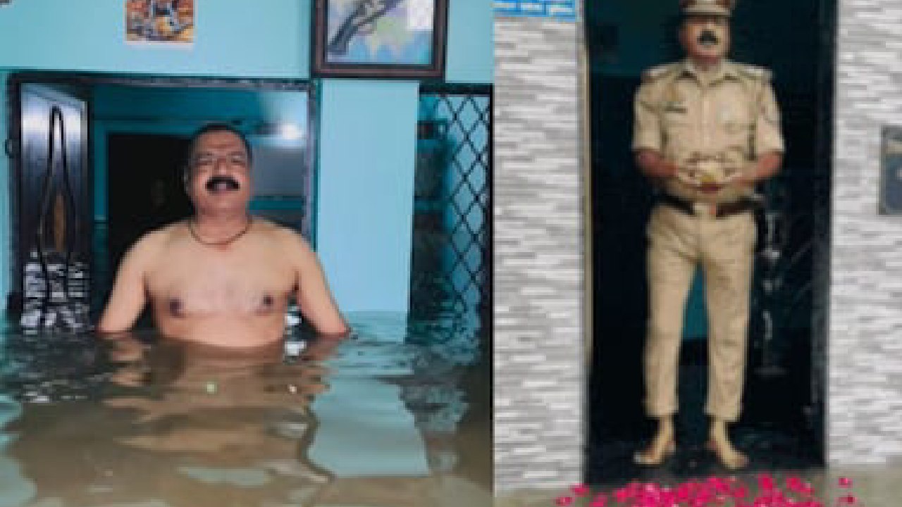 ಜಲಾವೃತಗೊಂಡಿರುವ ಮನೆ ಬಾಗಿಲಲ್ಲಿ ನಿಂತು ಗಂಗಾರತಿ ಮಾಡಿದ ಪೊಲೀಸ್